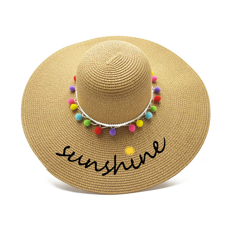 „Pompom Trim Lady UPF 50 Floppy Straw Hat“.